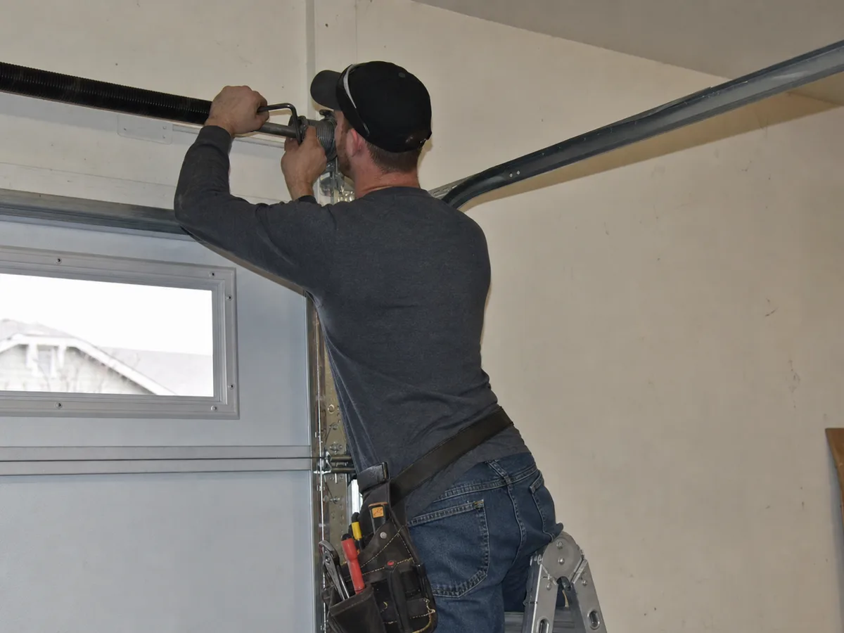 Garage Door repair technician on the job in Tempe, AZ